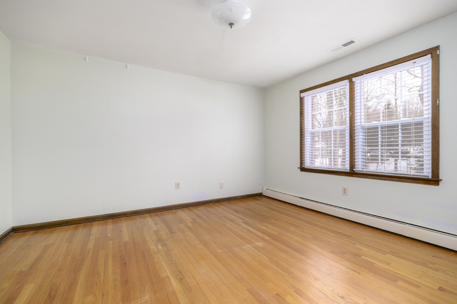 Empty Naugatuck CT 12 by 13 bedroom before virtual staging