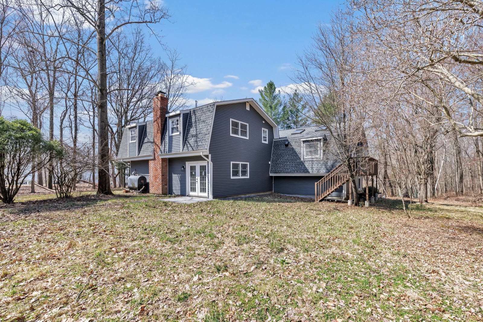 Empty New Milford CT side yard before virtual staging as play area