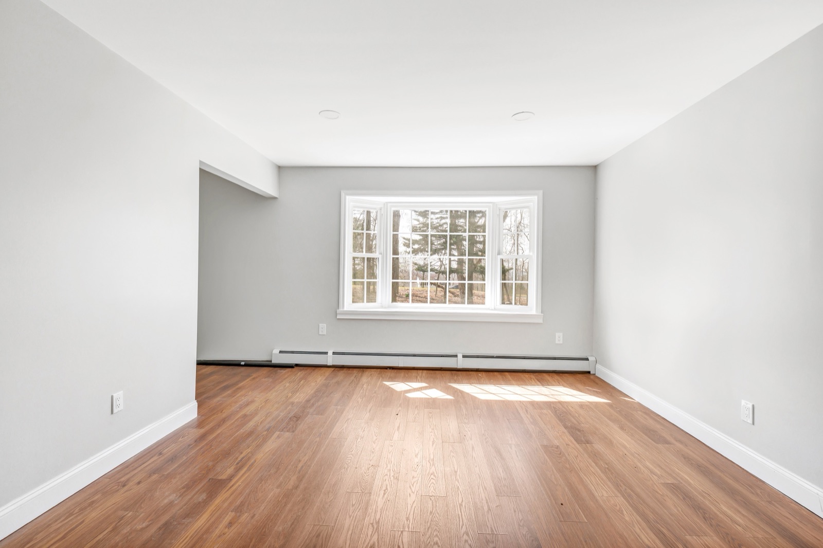 Empty New Milford CT first-floor music room before virtual staging