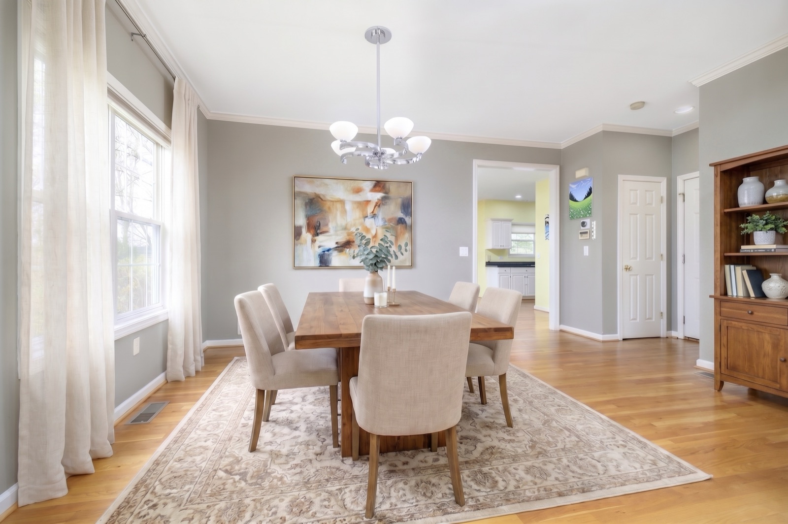 Norwalk CT dining area after virtual staging with modern table and chandelier