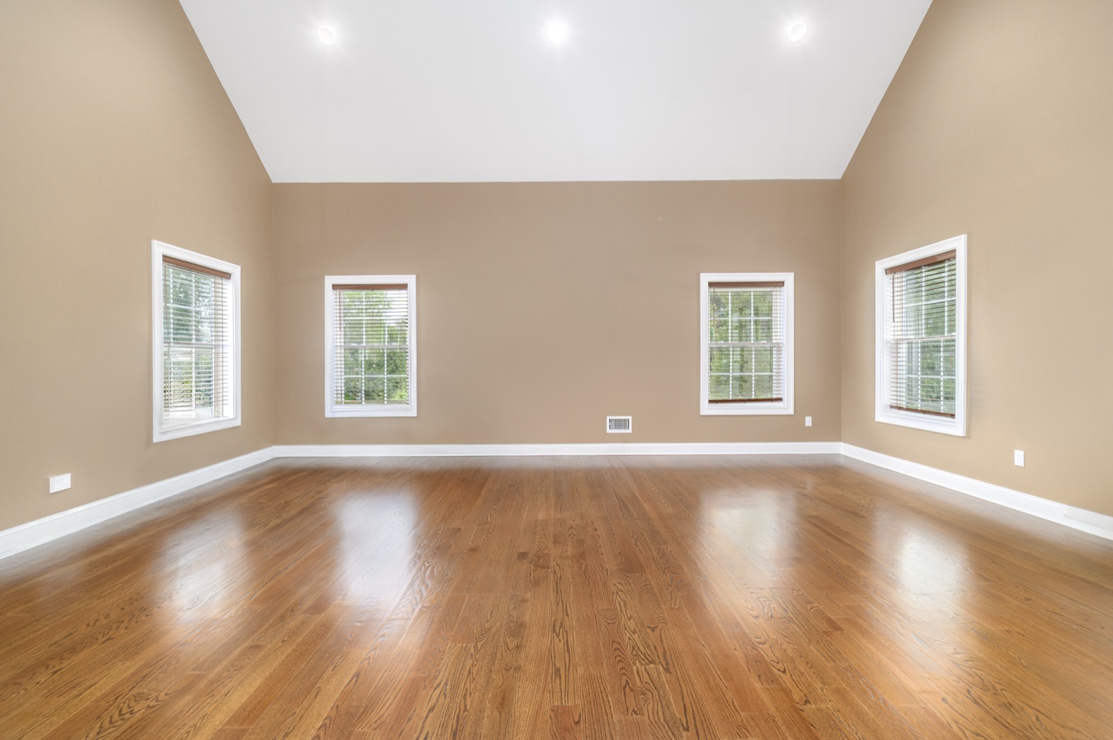 Empty Stamford CT vaulted great room before virtual staging
