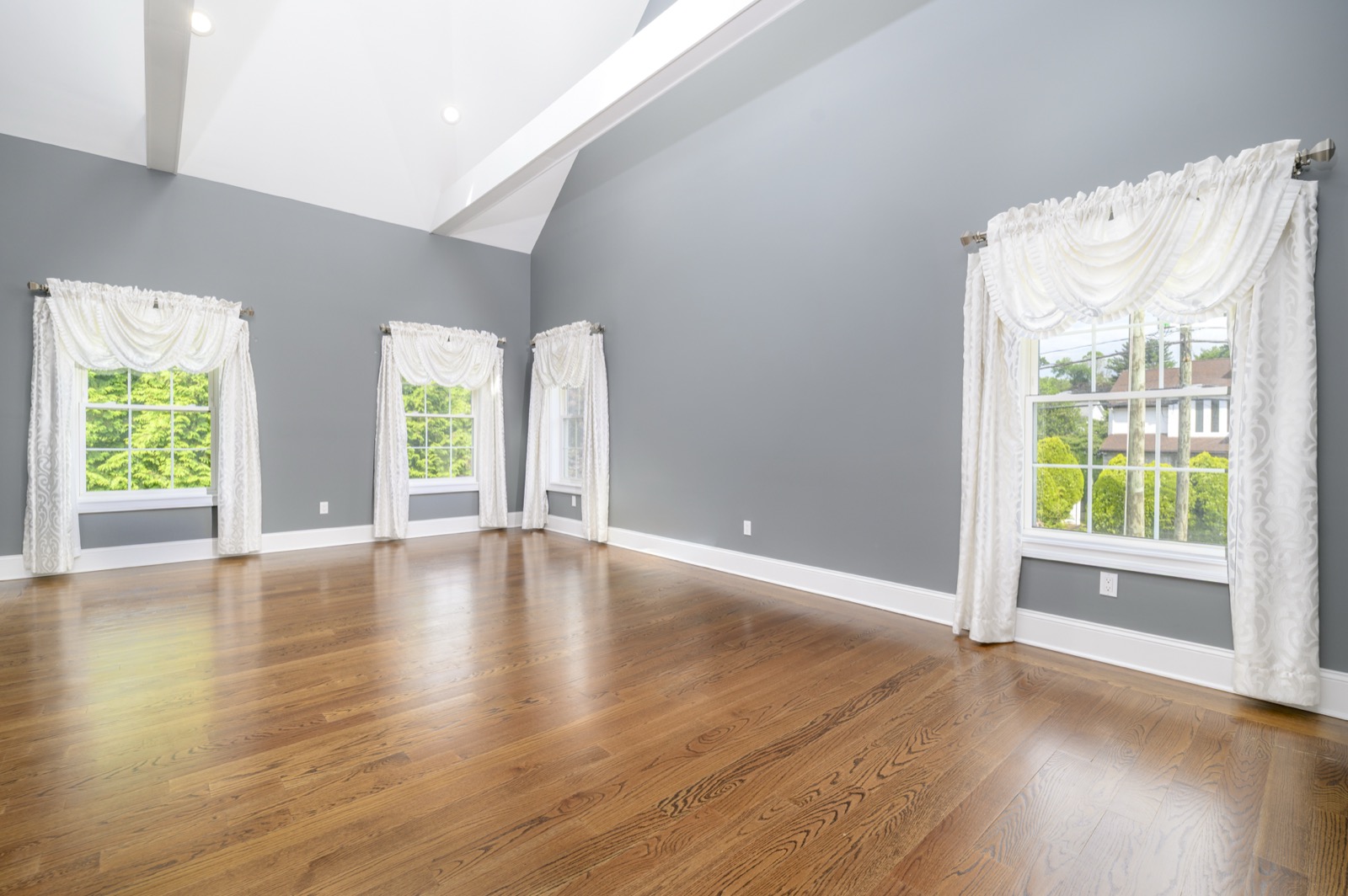 Empty Stamford CT vaulted primary bedroom before virtual staging